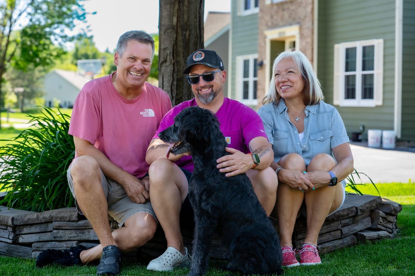 Minneapolis dog training results — happy family with their dog after completing Board and Train at North Star Family K-9